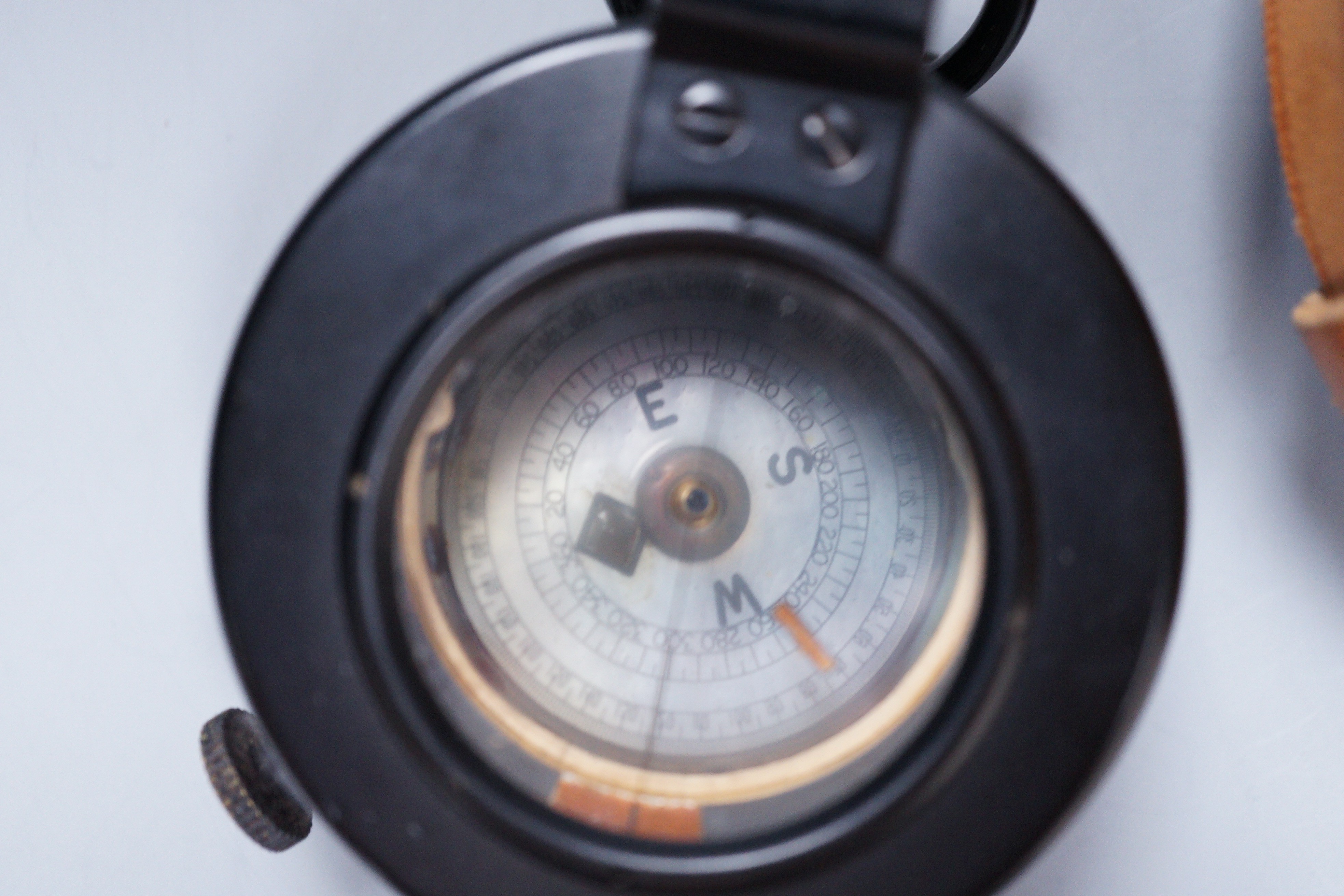 An E.R Watts and Son military compass, 1939 No 3233 MKIII in a leather case